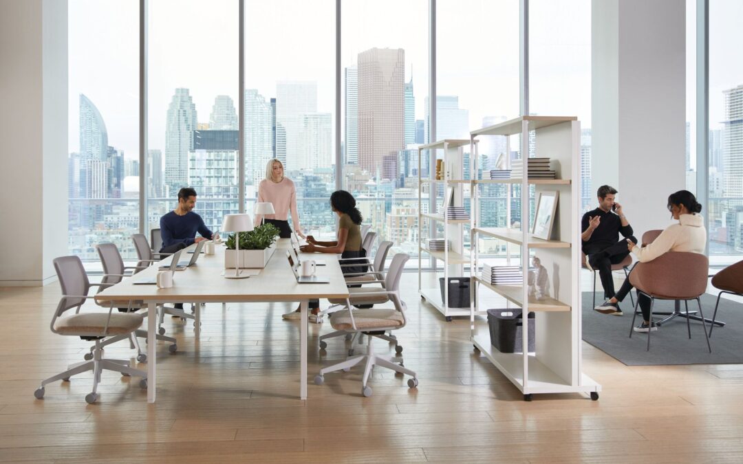 This photo shows an open office space with desks and collaborative hubs